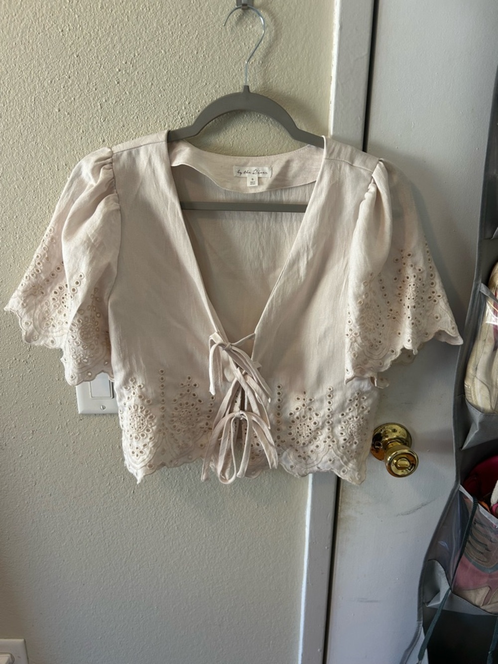 Tie-Front Eyelet Flutter Sleeve Blouse — Cream